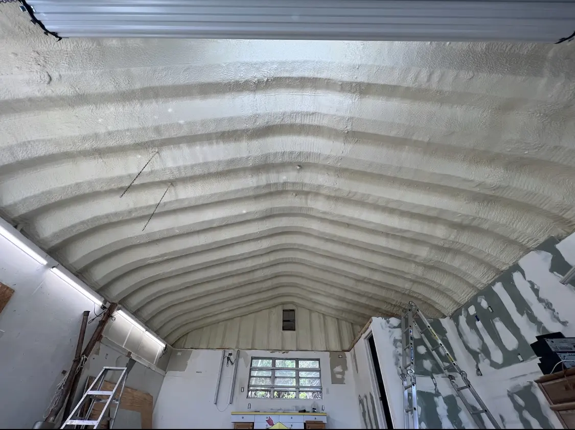 Spray polyurethane foam applied to the underside of a metal roof deck in Beckett Ridge